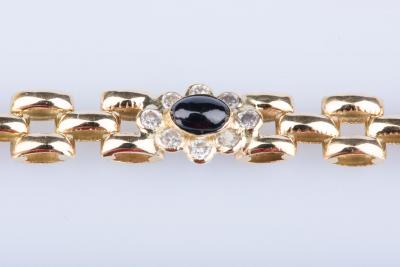 Bracelet en or jaune 18 ct 32 diamants env. 0.32 ct au total 4 saphirs 2