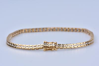 Bracelet en or jaune 18 ct (750/1000). 71 diamants 0,71 ct au total. 2